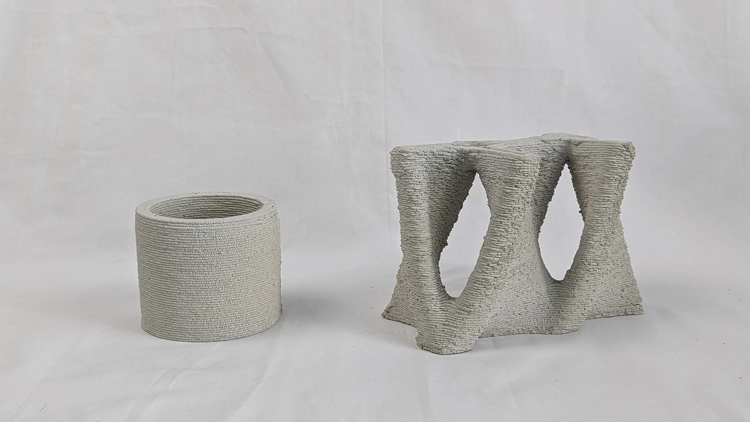 Cylindrical and triply periodic surface concrete specimens