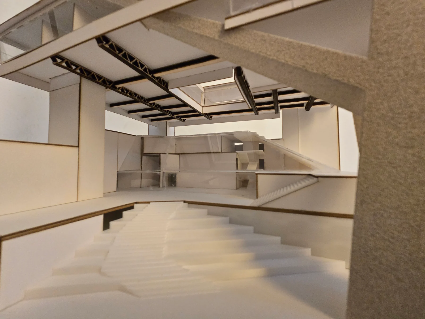 Dylan Simmons — physical model view beneath the canopy toward the shared interior