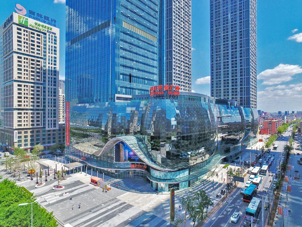 Built Kaisa Center, with its curved retail podium and office tower