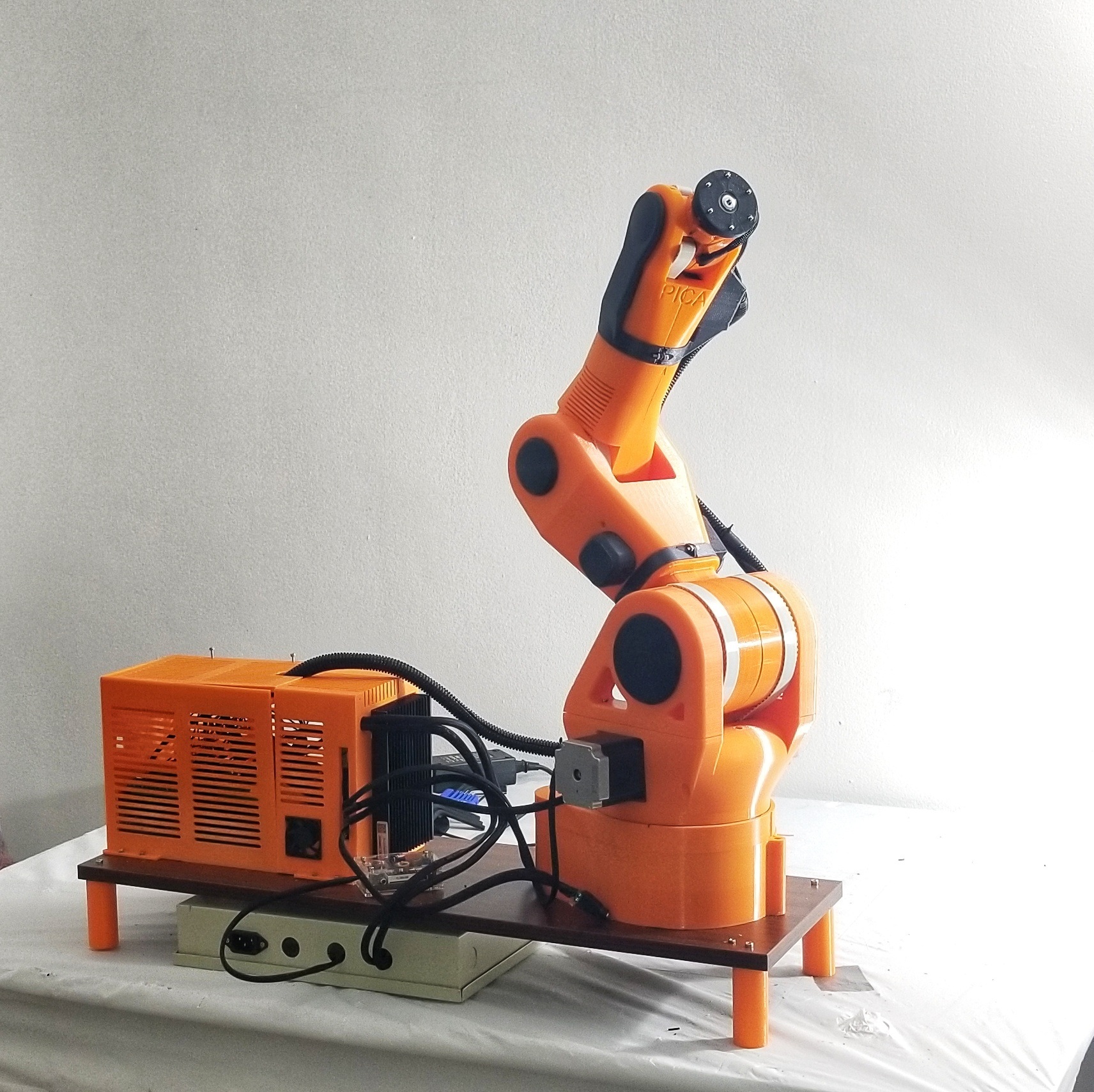 PICA six-axis robotic arm with its controller