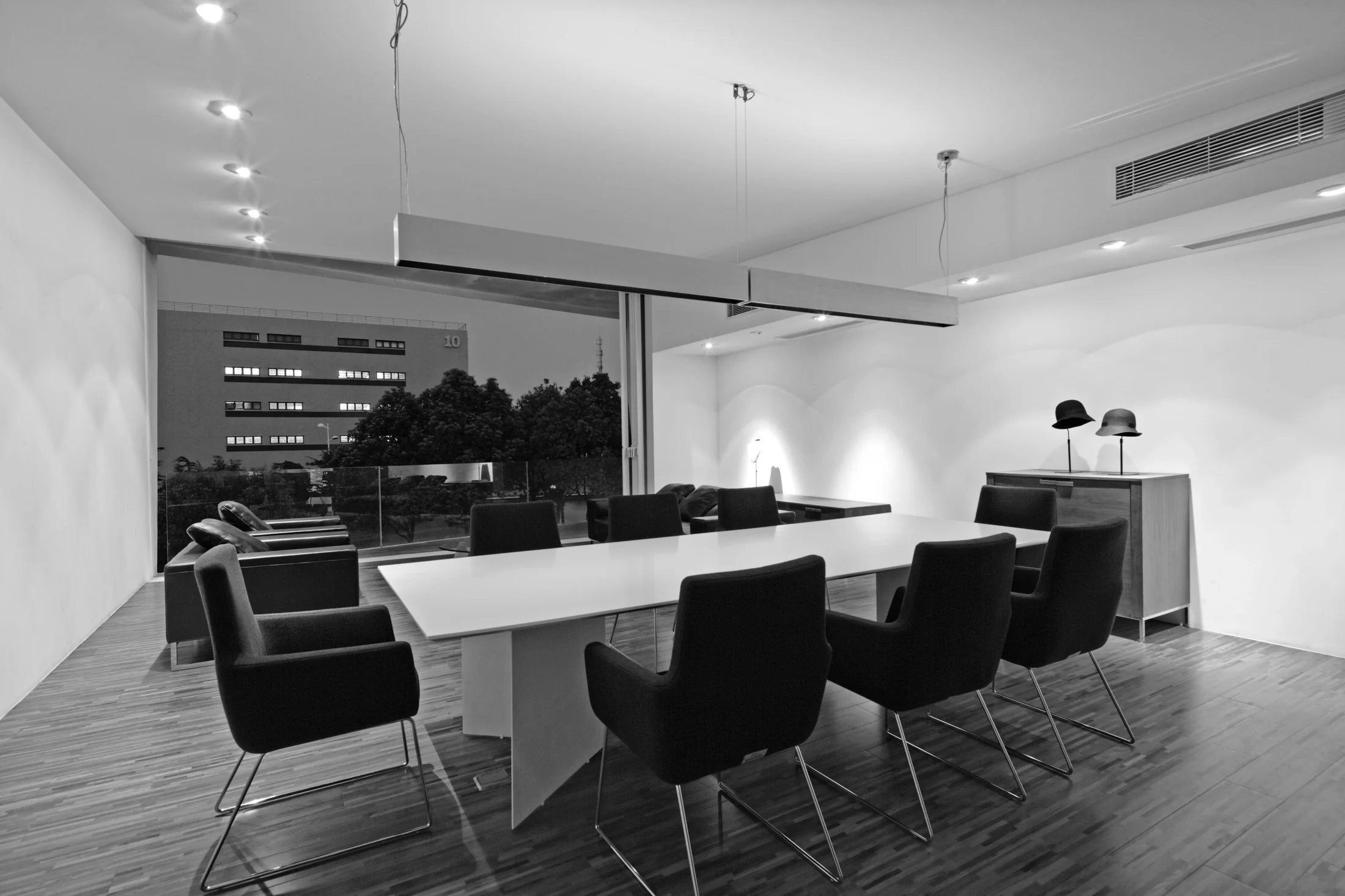 A shared table anchors the dining space within the compact clubhouse.
