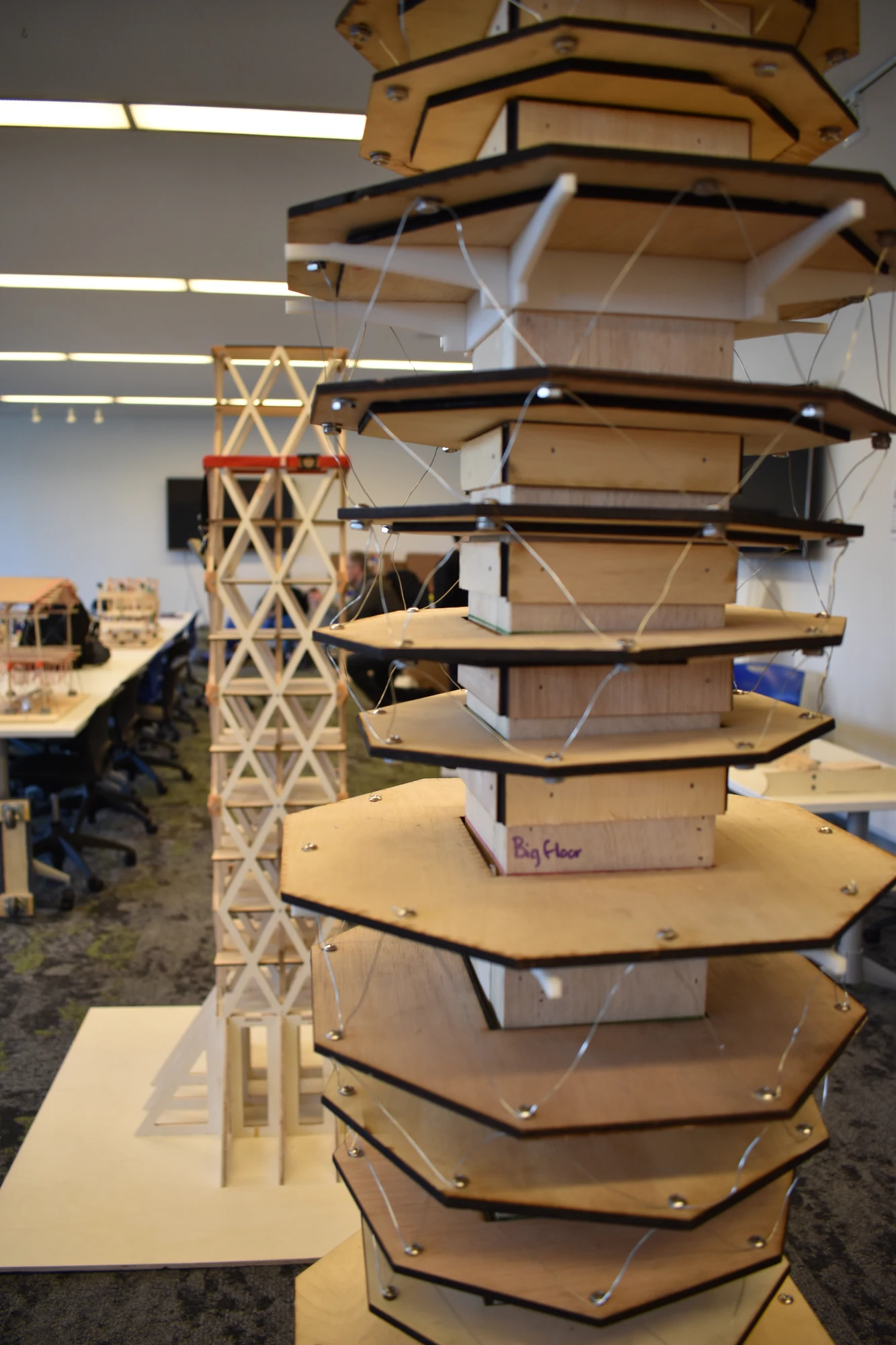 Justin Ackler, Ashton Barre, Hassan Charara, Muhammad Gonzales, Ajeonna Lee, and Thomas Lewis — cantilevered floor plates, central core, and perimeter wires