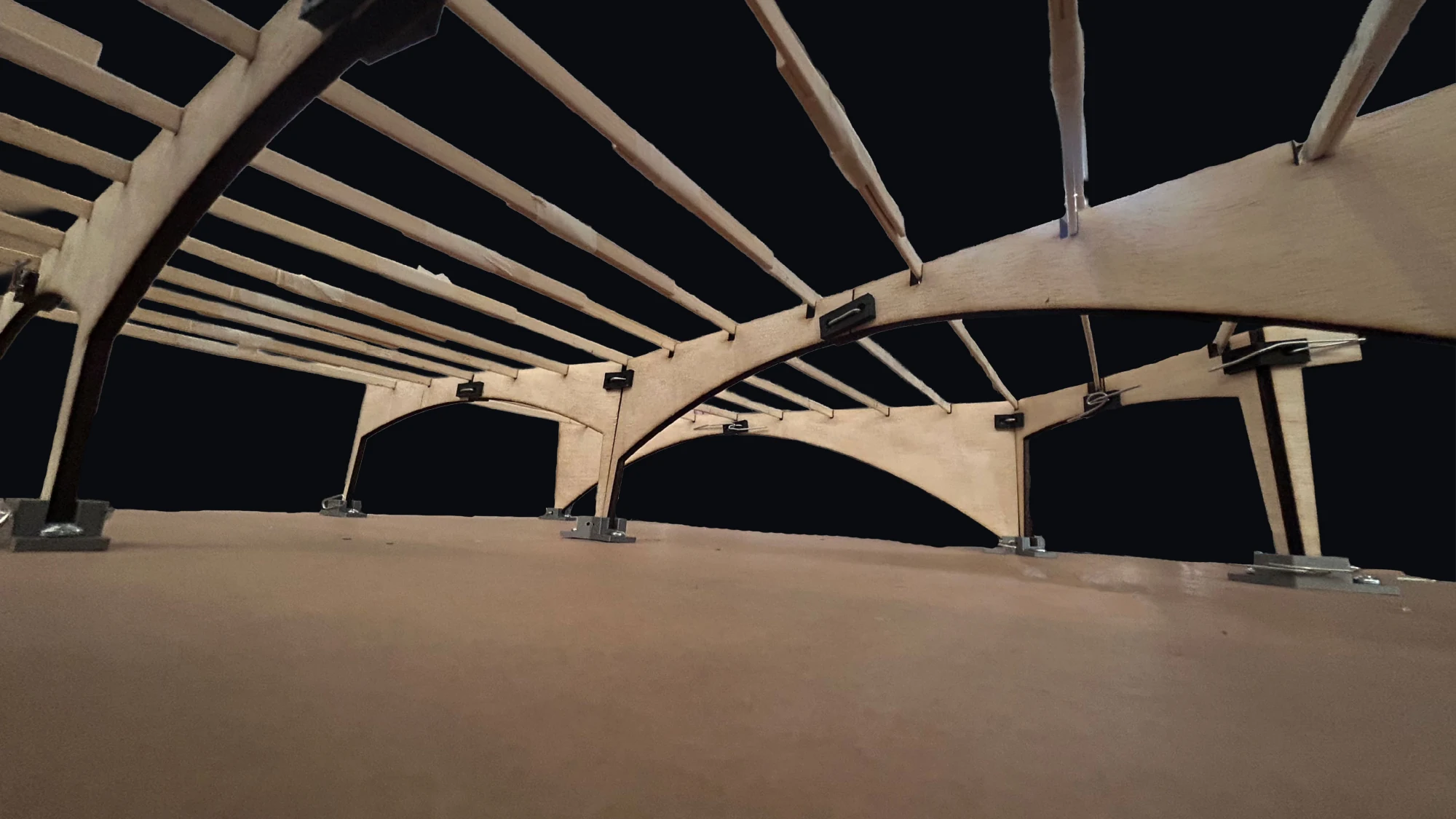 Dylan Ries and Tadhg McDonald — interior perspective beneath the tapered frames