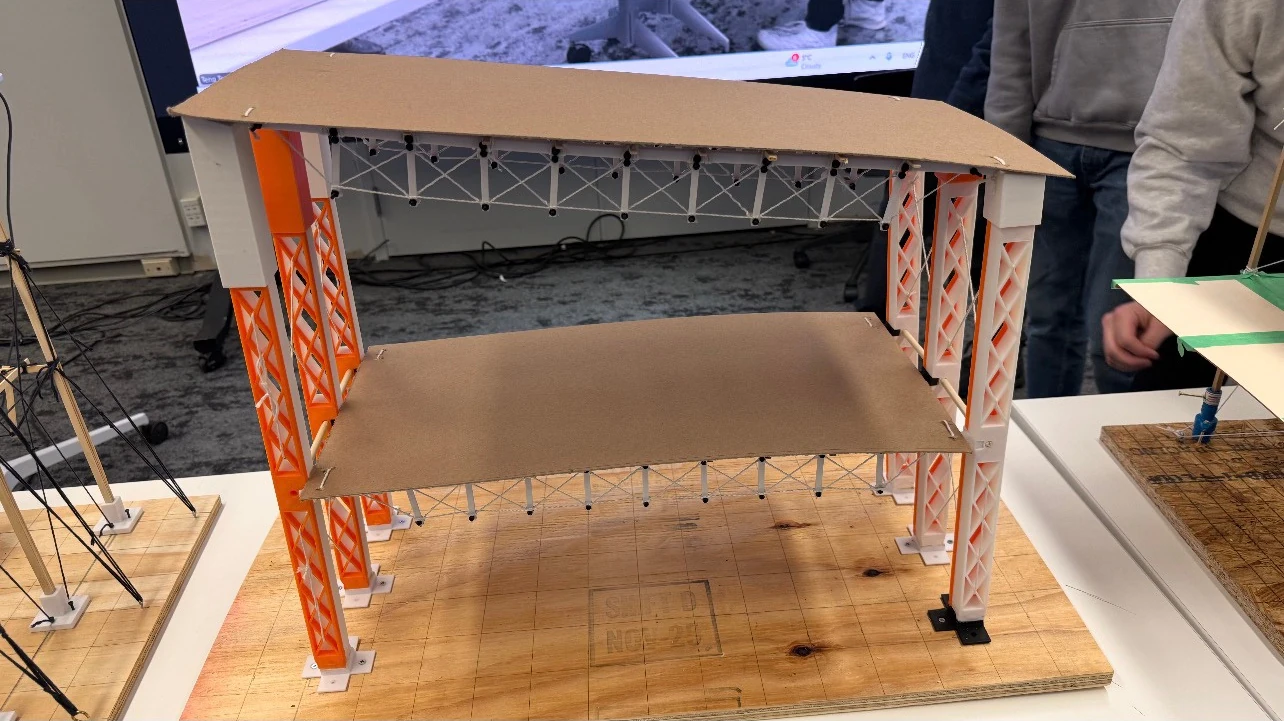 Brooke Kochel, Timotej Murcko, Carmen Martinez-Zamorano, and Olivia Burke — truss spans and printed columns in the assembled model
