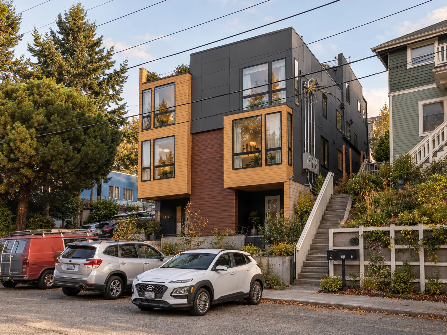 The uphill end of the development, with parking and pedestrian access beside the building.