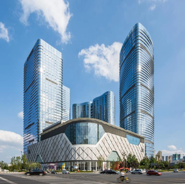 Built Yintai Centre in Chengdu, with curved glass towers above the retail podium